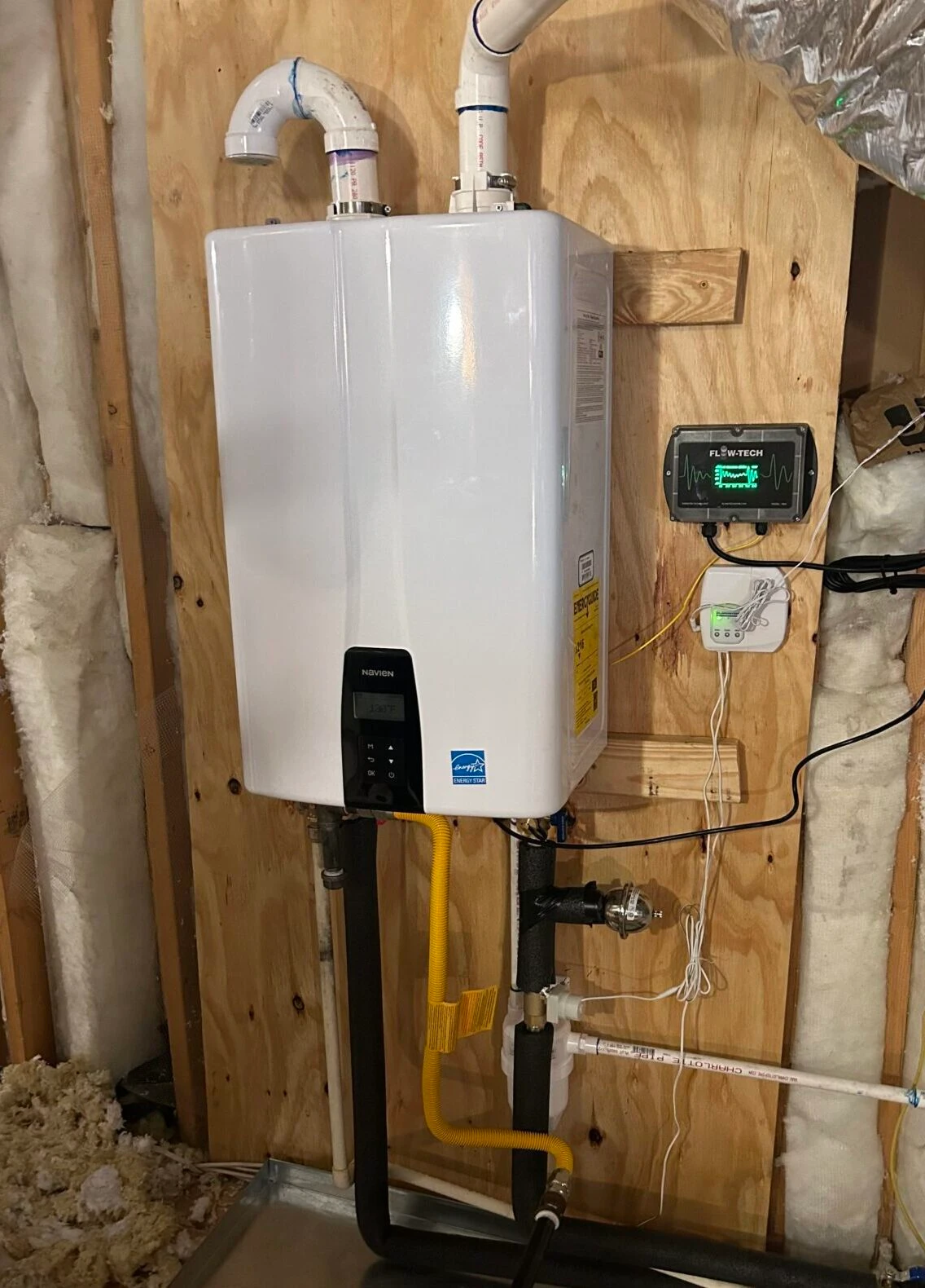 Plumbing technician setting up home water filtration in the University Park, TX